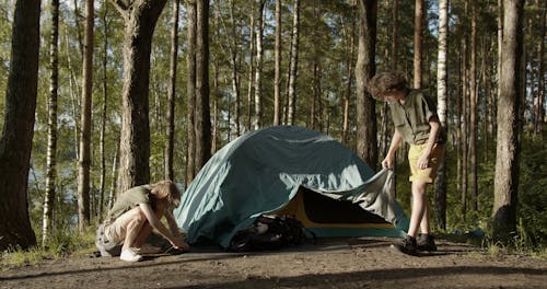 Group of Teenagers Camping on the Woods