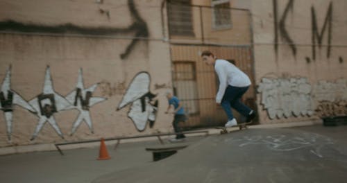 A Skateboarder Doing a Trick 