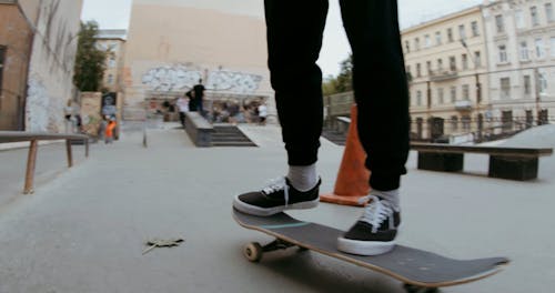 A Skateboarder Doing a Trick 