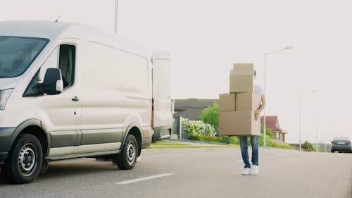 Video Of Man Carrying Boxes Of Goods