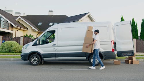 Video Of Delivery Man Carrying Boxes Of Goods