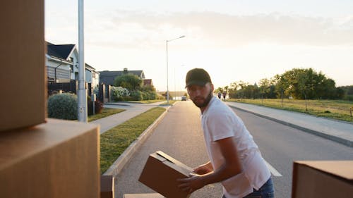 Video Of Delivery Man Loading Boxes To The Van 