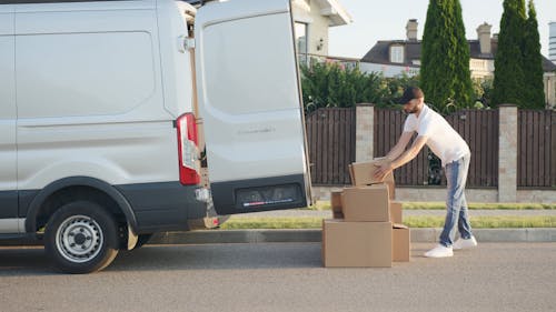 Man Loading Boxes into Van · Free Stock Video
