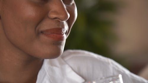 Close-Up View of a Woman Drinking Beer