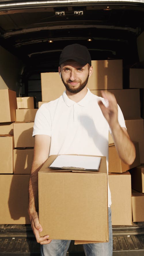 Delivery Man holding Courier Box