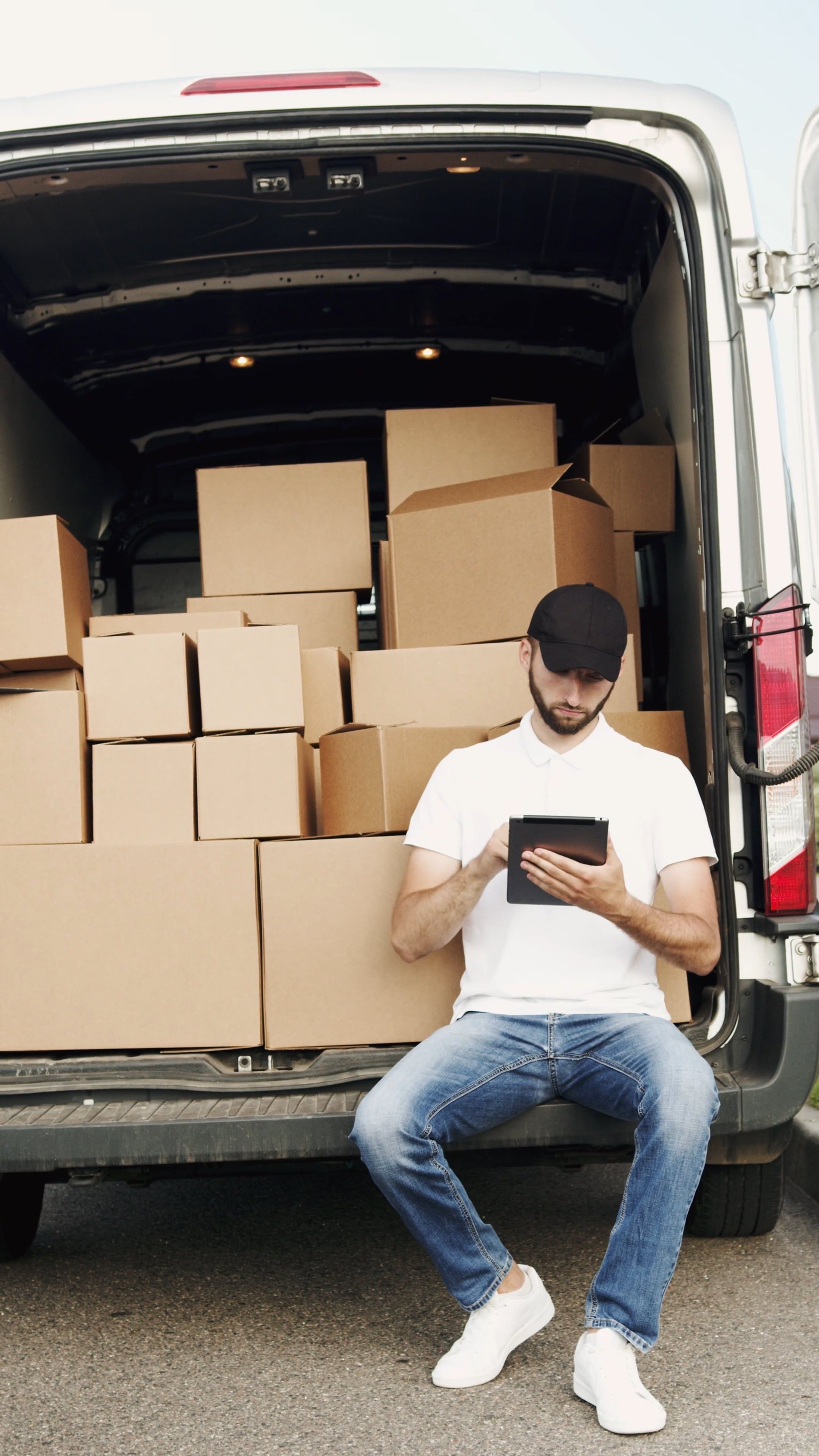 Delivery Man Checking the Cargo Boxes from List · Free Stock Video