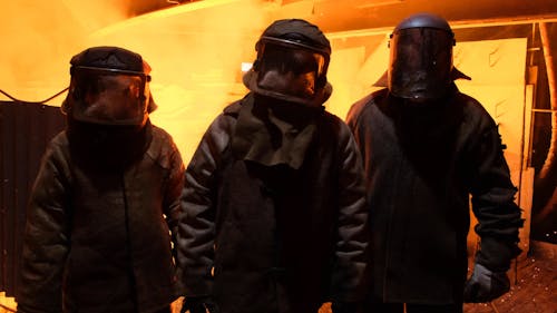 Three Workers in Industrial Suit