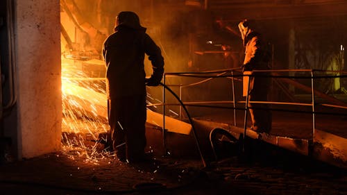 Workers Welding at a Factory