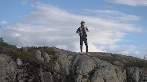 Man Traveler Returning back from Mountain Edge