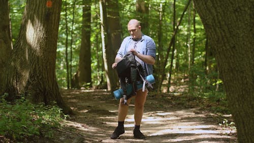 Man Carrying a Bag while Walking 