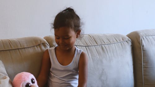 Kid Playing with Soft Toy