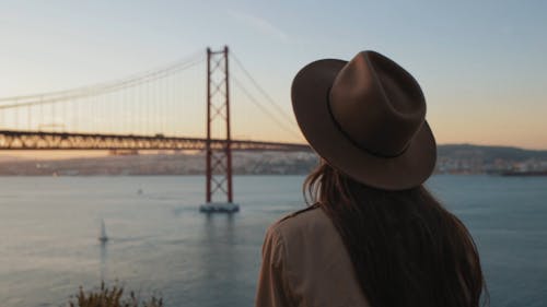A Woman Looking at a Scenic View of Lisbon