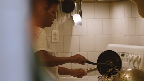 Woman Cooking in the Kitchen with Daughter