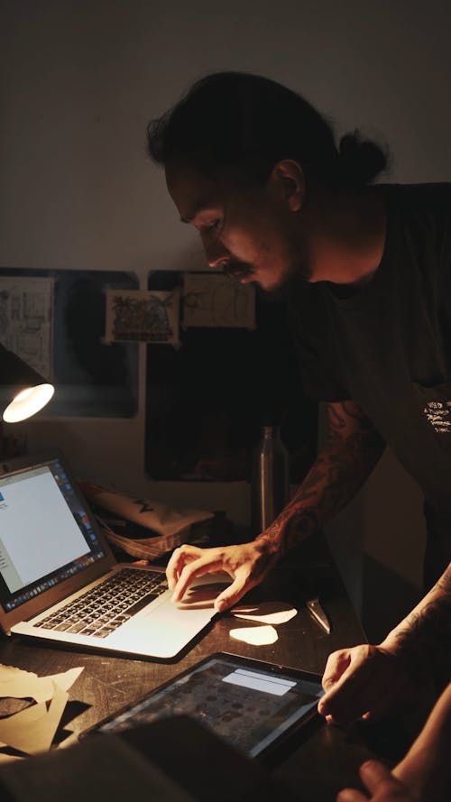 Artist Transferring Tattoo design to Laptop