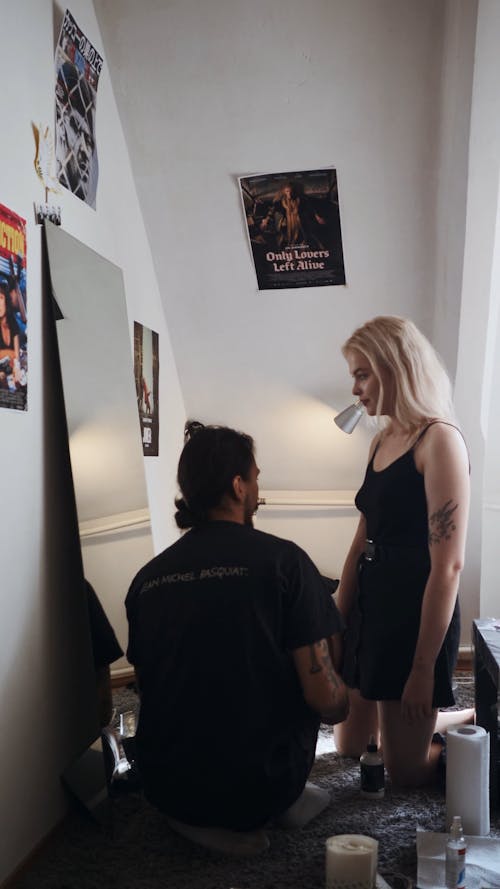 Couple Discussing about the Tattoo