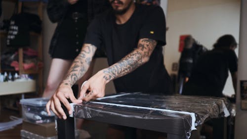 Tattoo Artist getting his Table ready