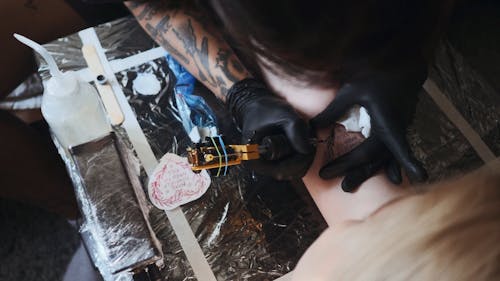 Person Making a Tattoo