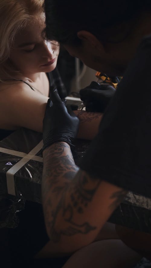 Person Making a Tattoo