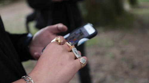 Close-Up View of a Person Using a Cellphone