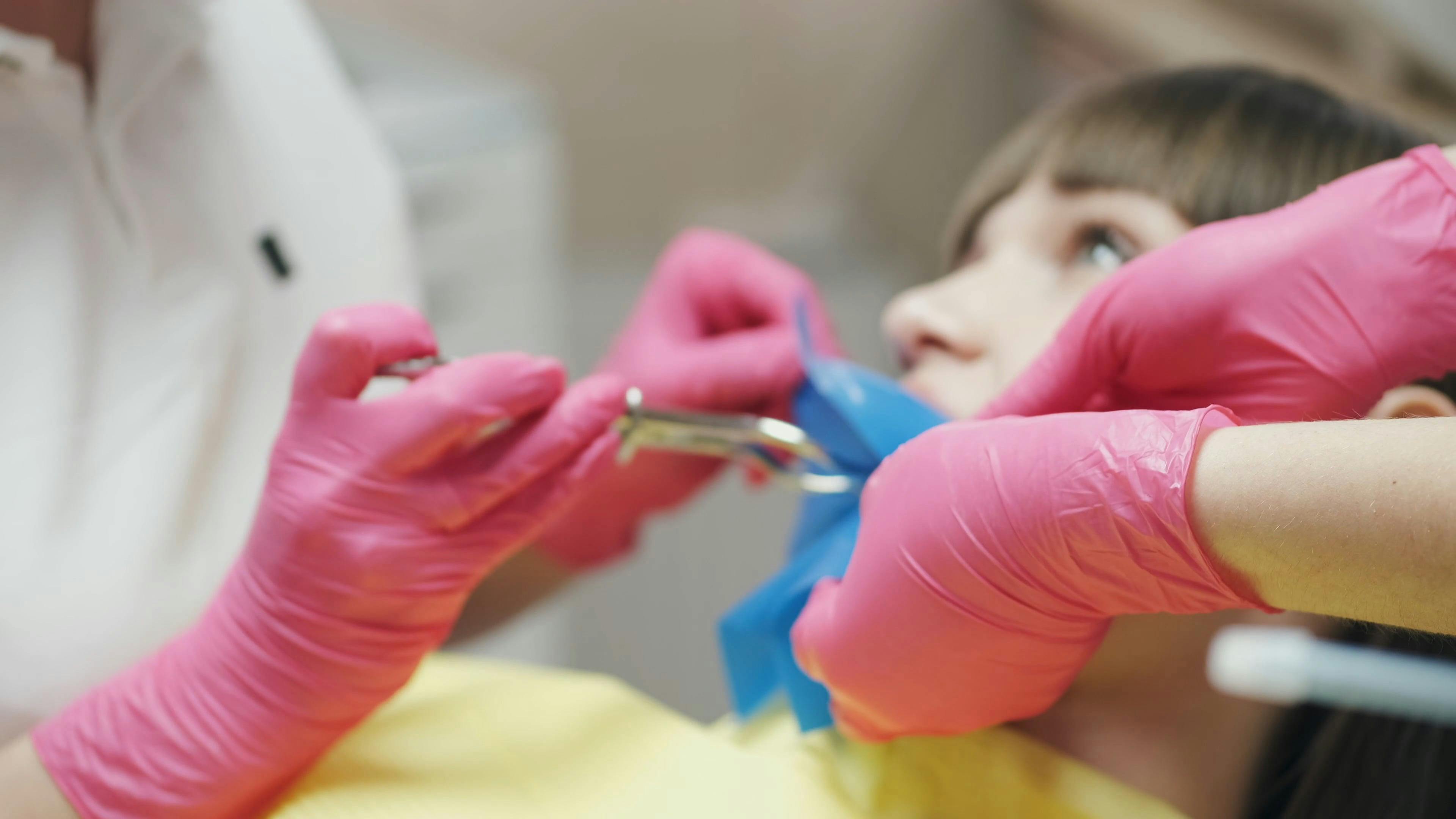 Dentist Putting Dental dam in Patient's Mouth Free Stock Video Footage
