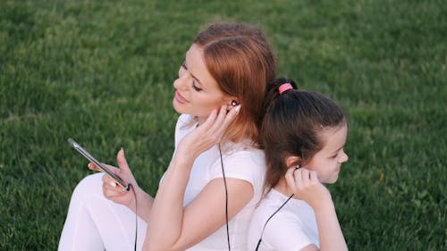 Mother and Daughter Listening to a Music