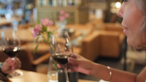 Close-Up View of a Woman Drinking Red Wine