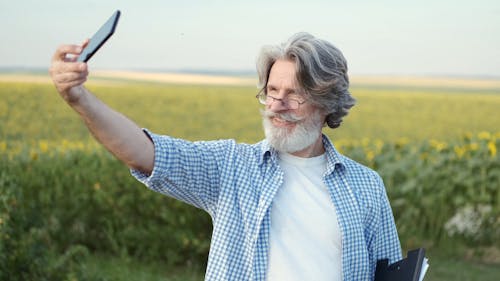 Elderly Man Taking a Selfie