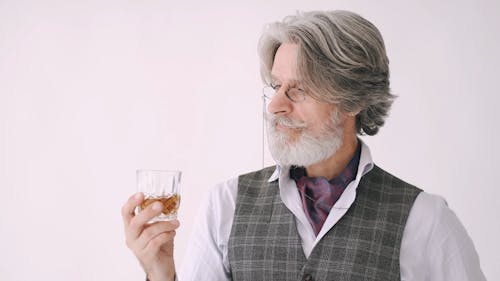 Old Man Smelling the Aroma of Fine Whisky