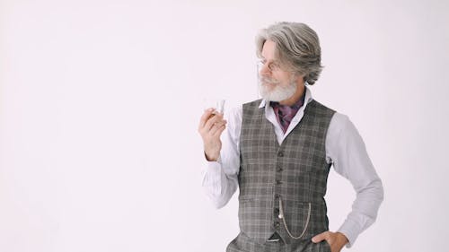 Man Holding a Glass of Whiskey