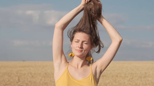 Young Caucasian Woman Playing with her Hairs