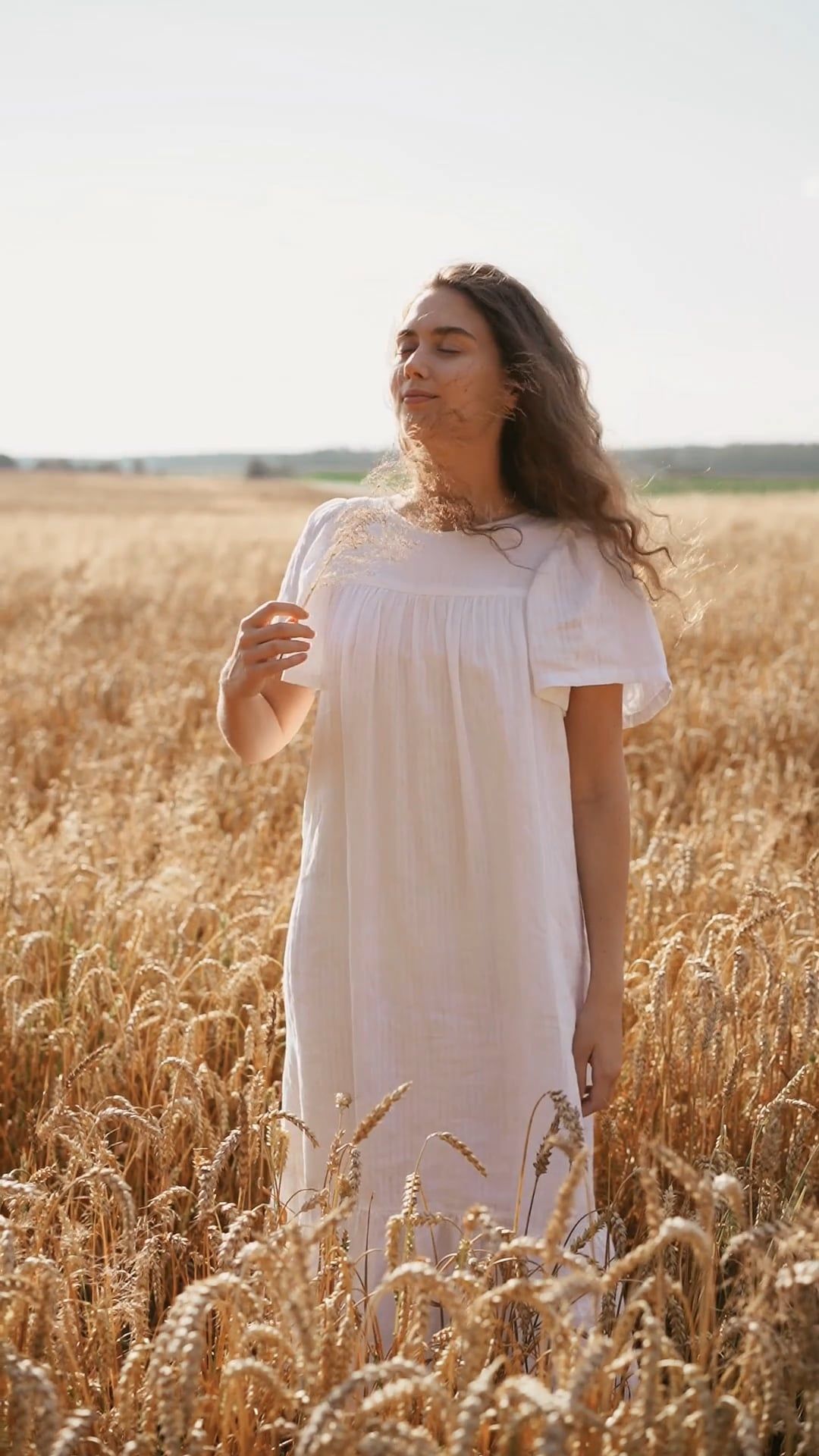 Woman in White Dress Standing in a Wheat Field · Free Stock Video