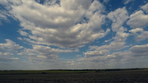 An Agricultural Land under Cumulus Clouds