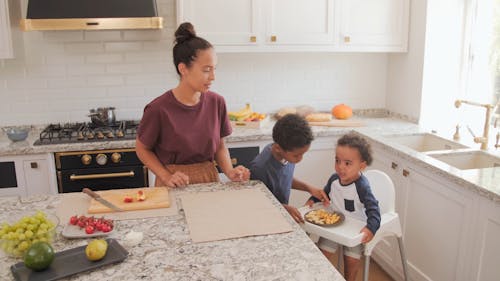 Mother with her Kids in Kitchen