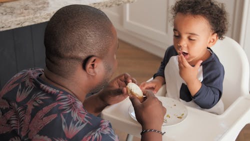 Father Helping Kid to Finish his Meal