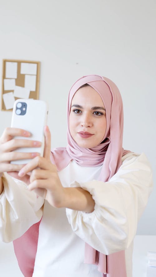 Woman in Pink Hijab Talking a Selfie