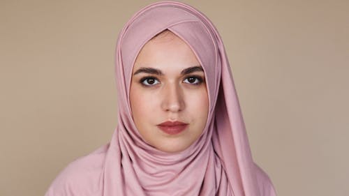 Woman in Pink Hijab Looking Serious