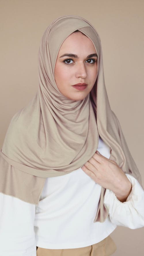 Woman in Brown Hijab Looking Serious