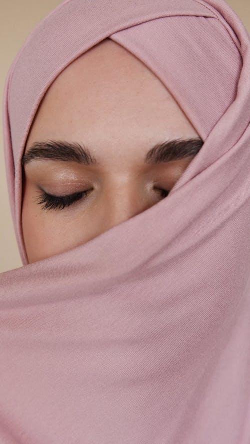 Close-Up View of Woman in Pink Hijab Smiling