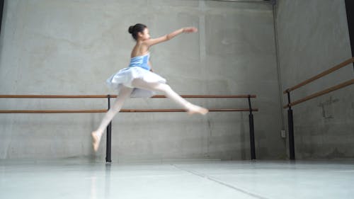 Girl in Blue Tutu Doing Ballet