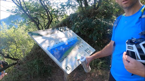 Hiker Looking at the Route Map