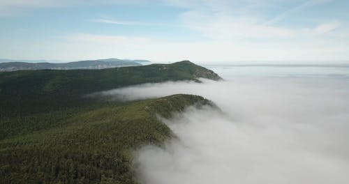 Aerial View of Mist Covered Mountains