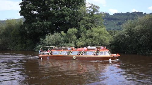 Red Ferry Boat with Passengers