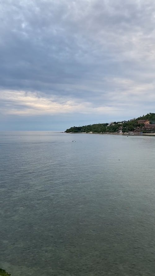 Scenery of Beach Under Cloudy Sky