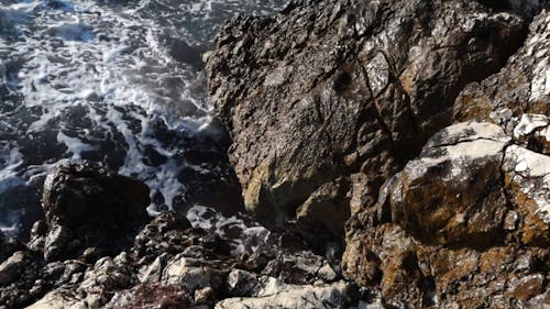 Sea Waves Crashing on Rocky Shore