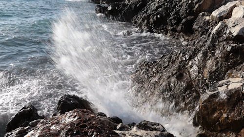 Sea Waves Crashing on Rocky Shore