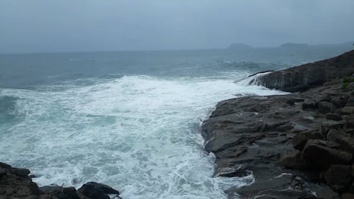 Sea Waves Crashing on Rocky Coast