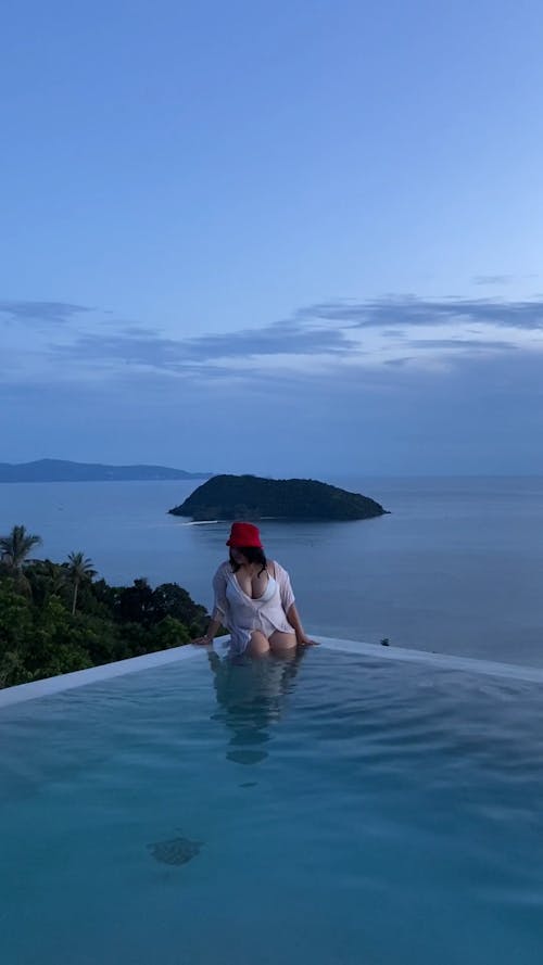 Bold and Beautiful Woman at Infinity Pool