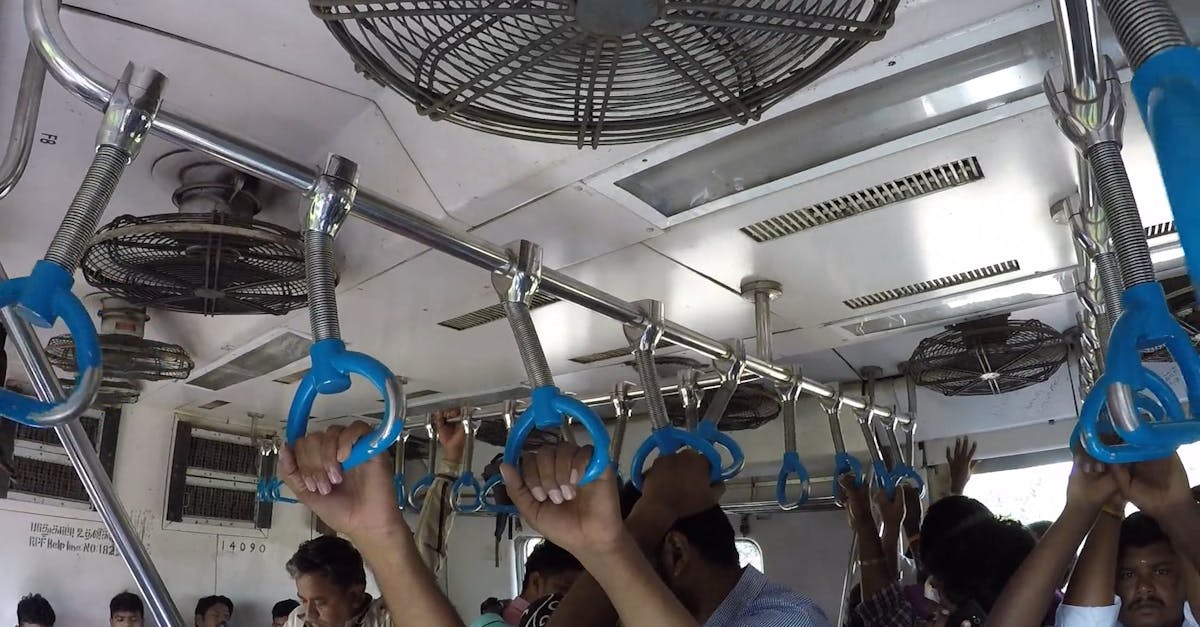 People Holding onto the Handrails Inside the Train Free Stock Video ...
