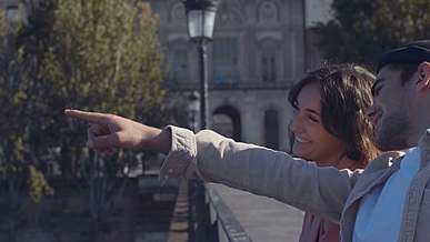 man and woman talking to each other while smiling