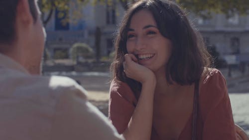 Woman Talking to Her Boyfriend While Smiling